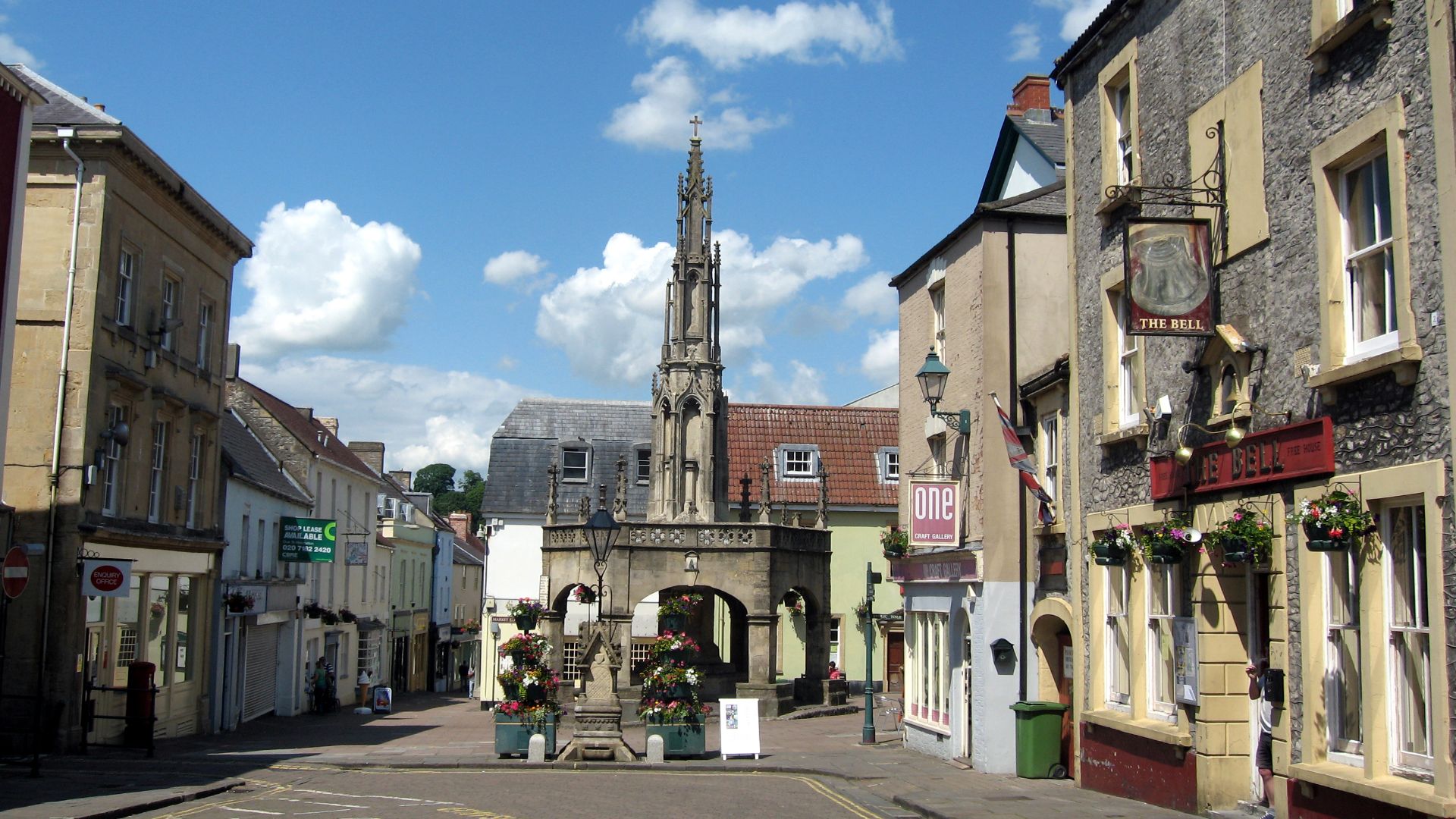 The car-free marketplace and floral decorations of Shepton Mallet, a small town on the edge of the Mendip Hills in Somerset, UK. The town is marked in the Domesday Book of 1086 and successive market charters were granted in 1235, 1260 and 1318. The princi