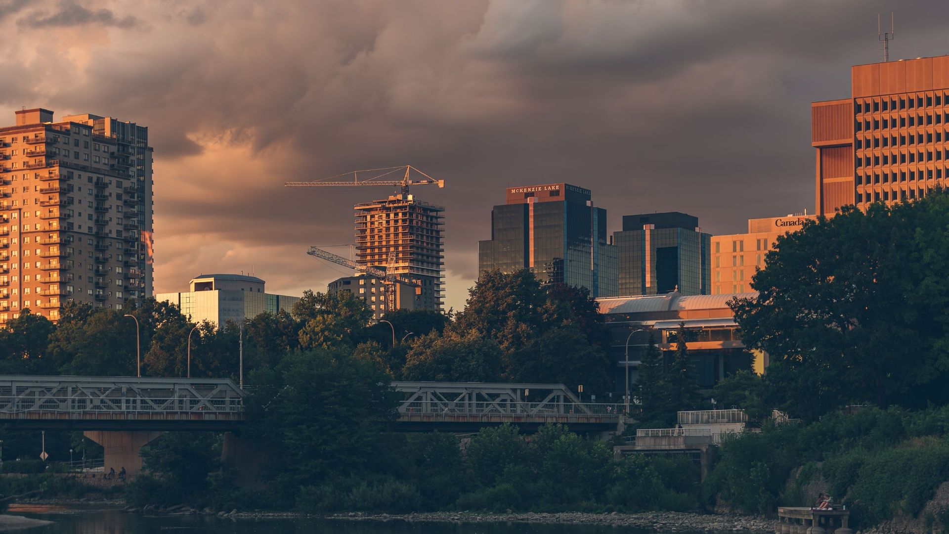 A beautiful evening view of London's skyline with dramatic clouds and sunset light.