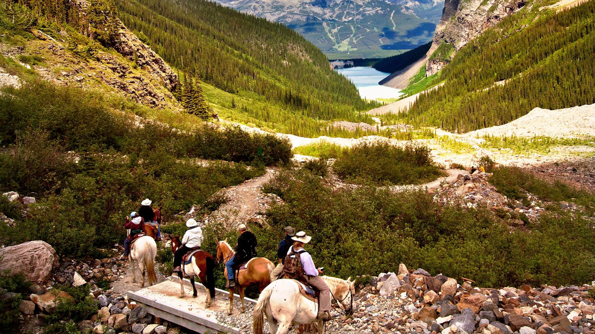 Explore breathtaking views of Banff National Park on horseback, surrounded by majestic mountains.
