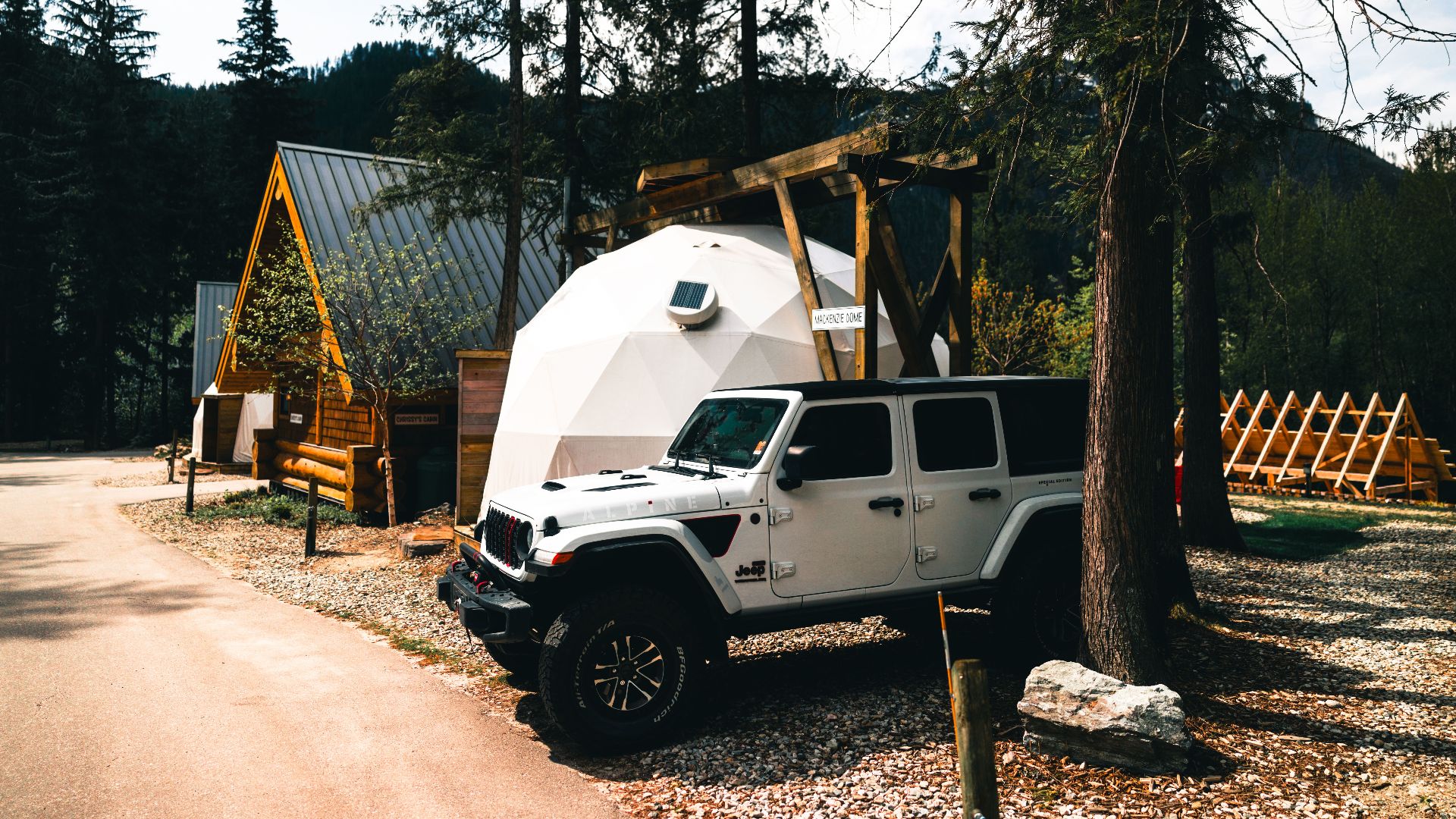 Explore the wilderness in Revelstoke, British Columbia with a stylish campsite and rugged Jeep.