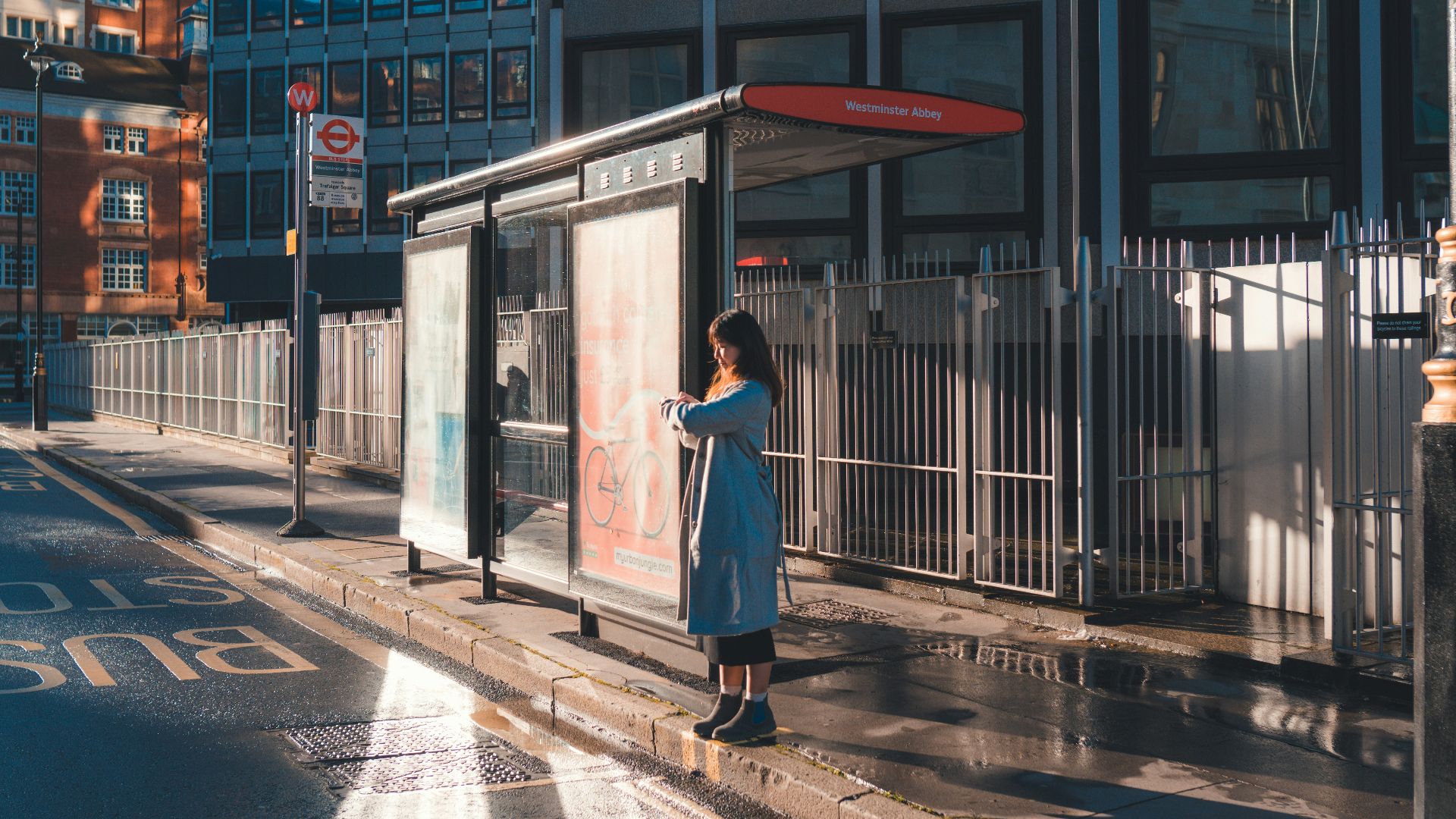 woman in white dress standing near building during daytime