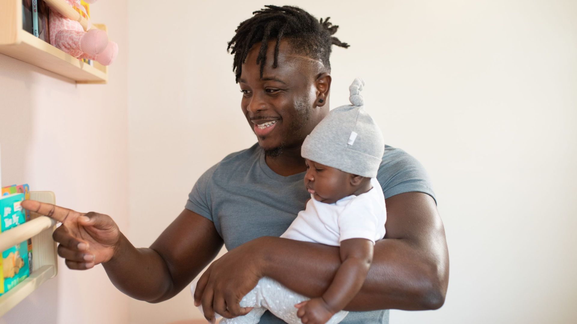 A heartwarming moment of a father bonding with his baby in a cozy setting.