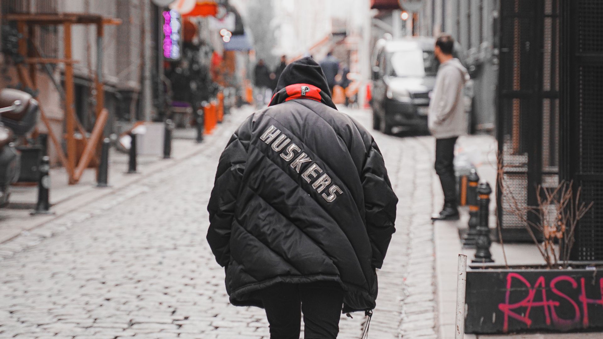 A person walks down a cobblestone street in Istanbul, Turkey.