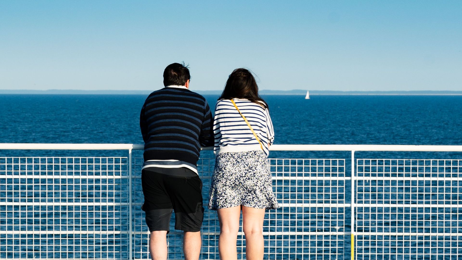 A couple enjoys the scenic views on a ferry ride across the Baltic Sea.