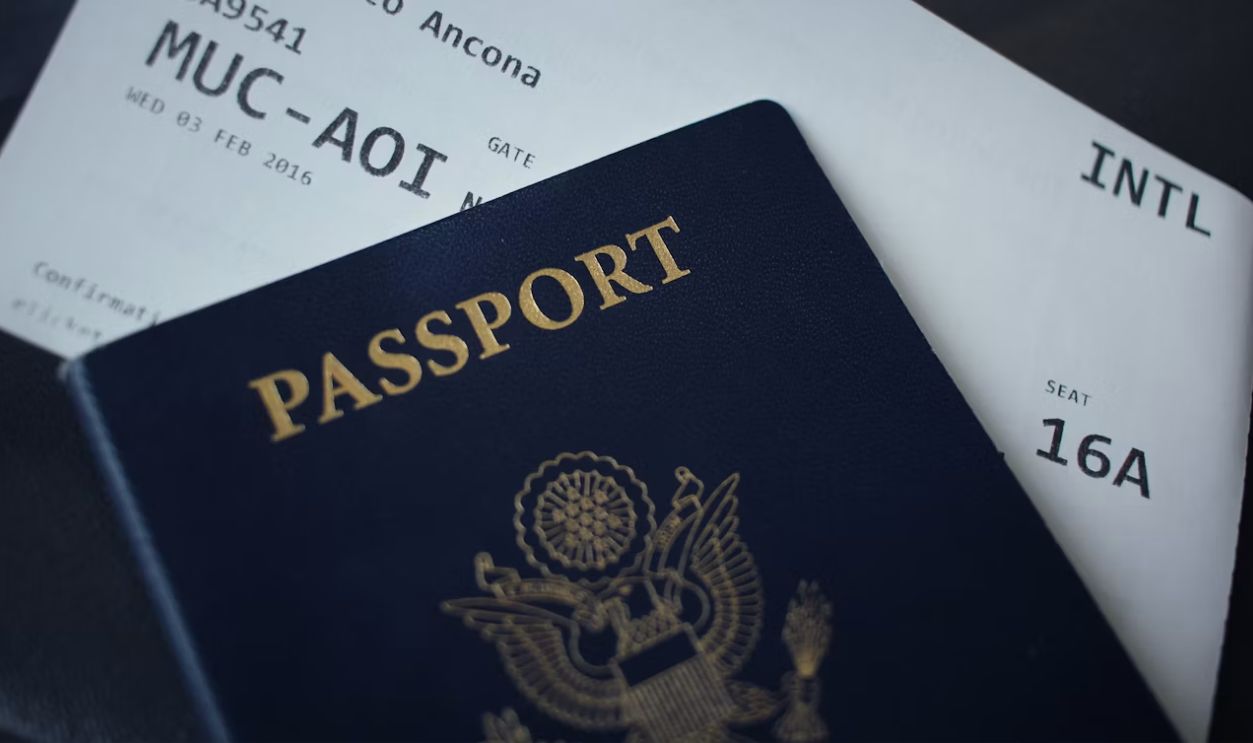 passport booklet on top of white paper