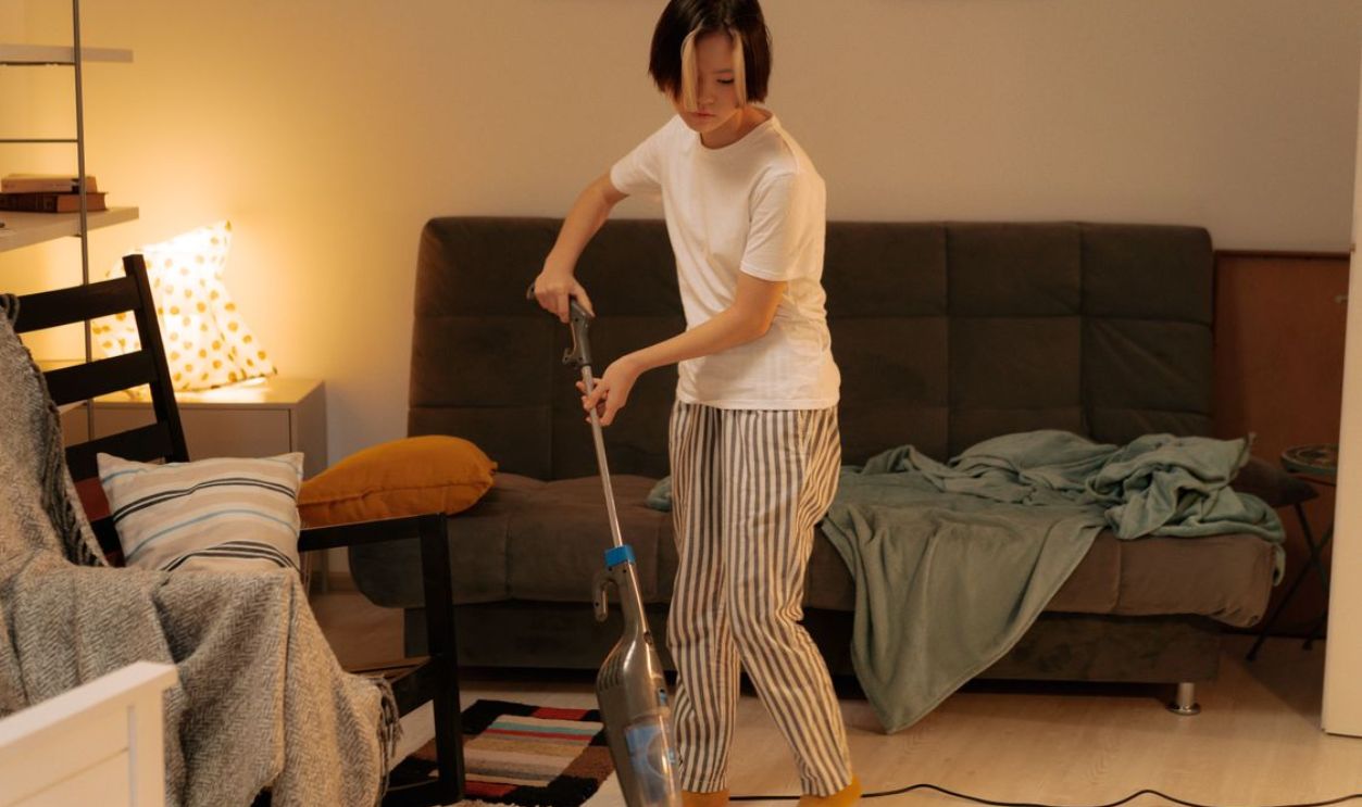 vacuuming the room 