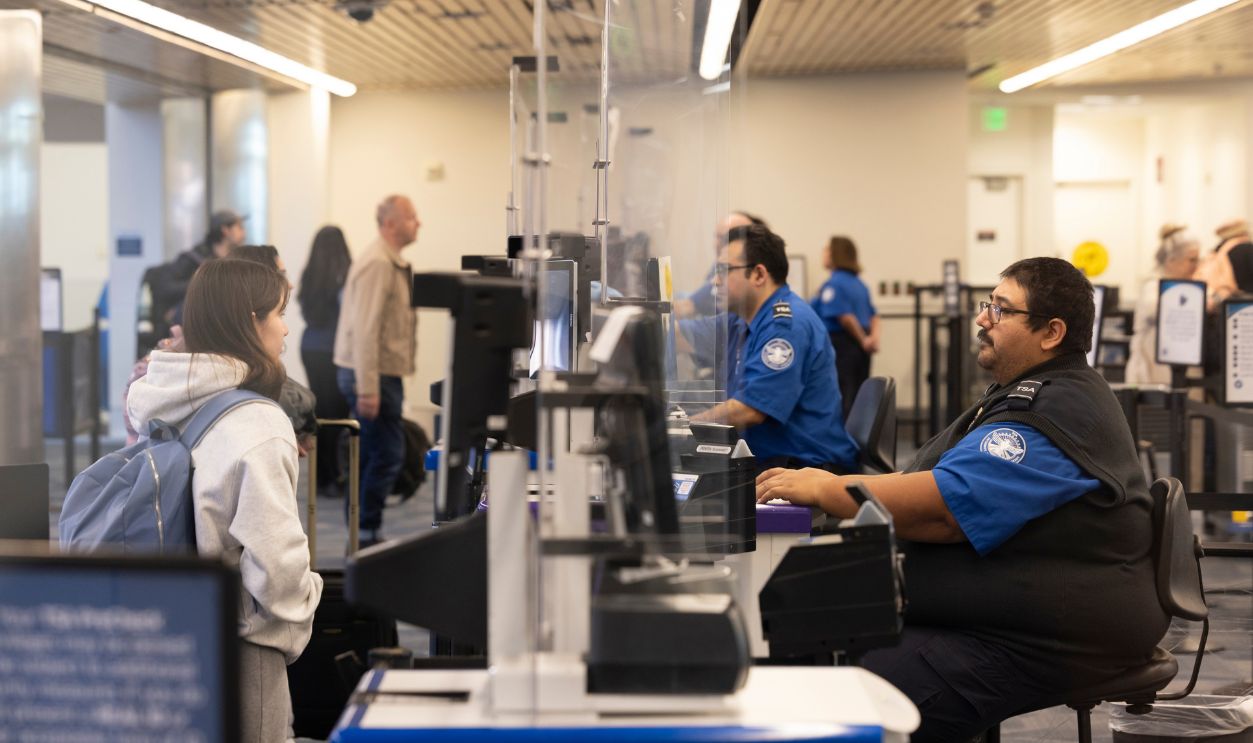 San Jose, California, USA - November 22, 2025: A traveler has their documents checked with the TSA at the San Jose International Airport. 