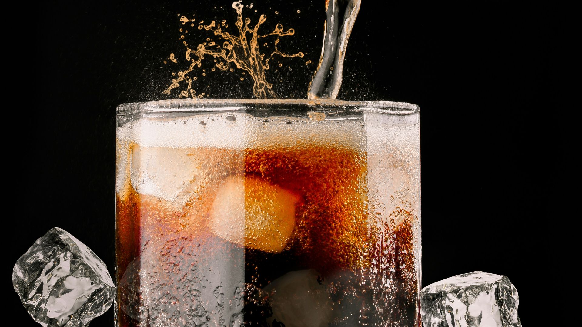 clear drinking glass with brown liquid
