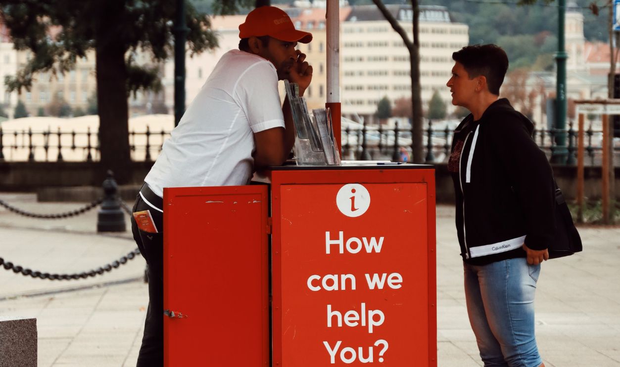 Street scene with a red tourist information booth in Budapest, Hungary