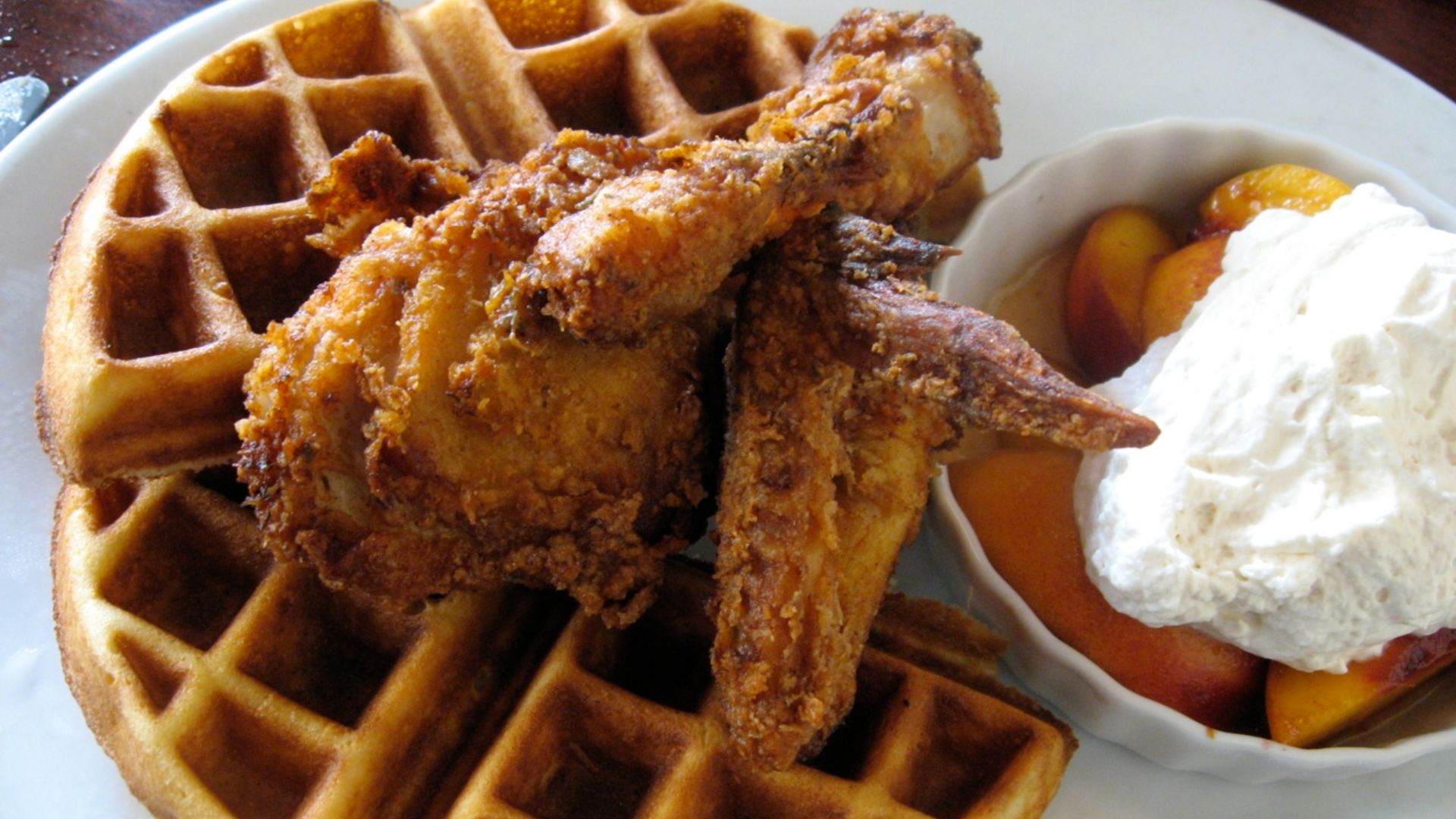 Chicken and waffles with peaches and cream