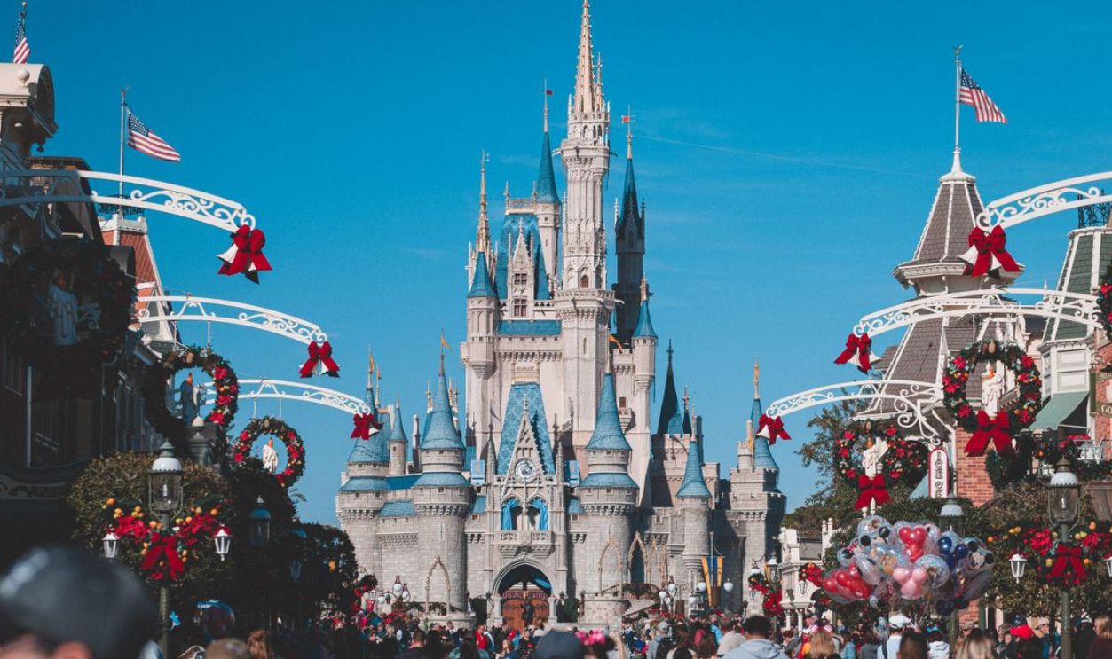 A busy day at Orlando's Magic Kingdom with crowds enjoying holiday decorations