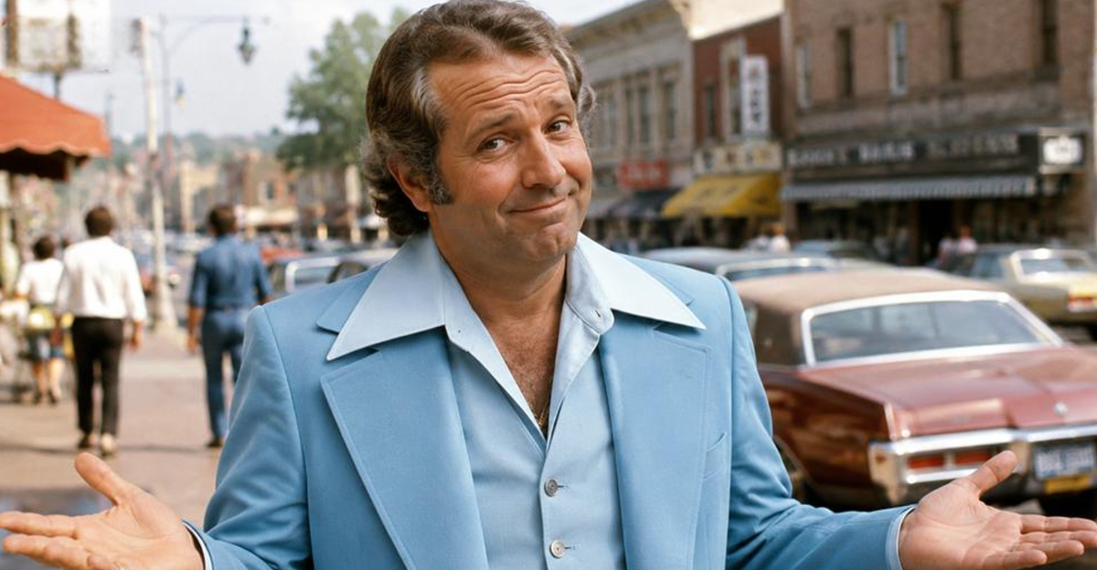 man in 1970s wearing leisure suit looking at camera