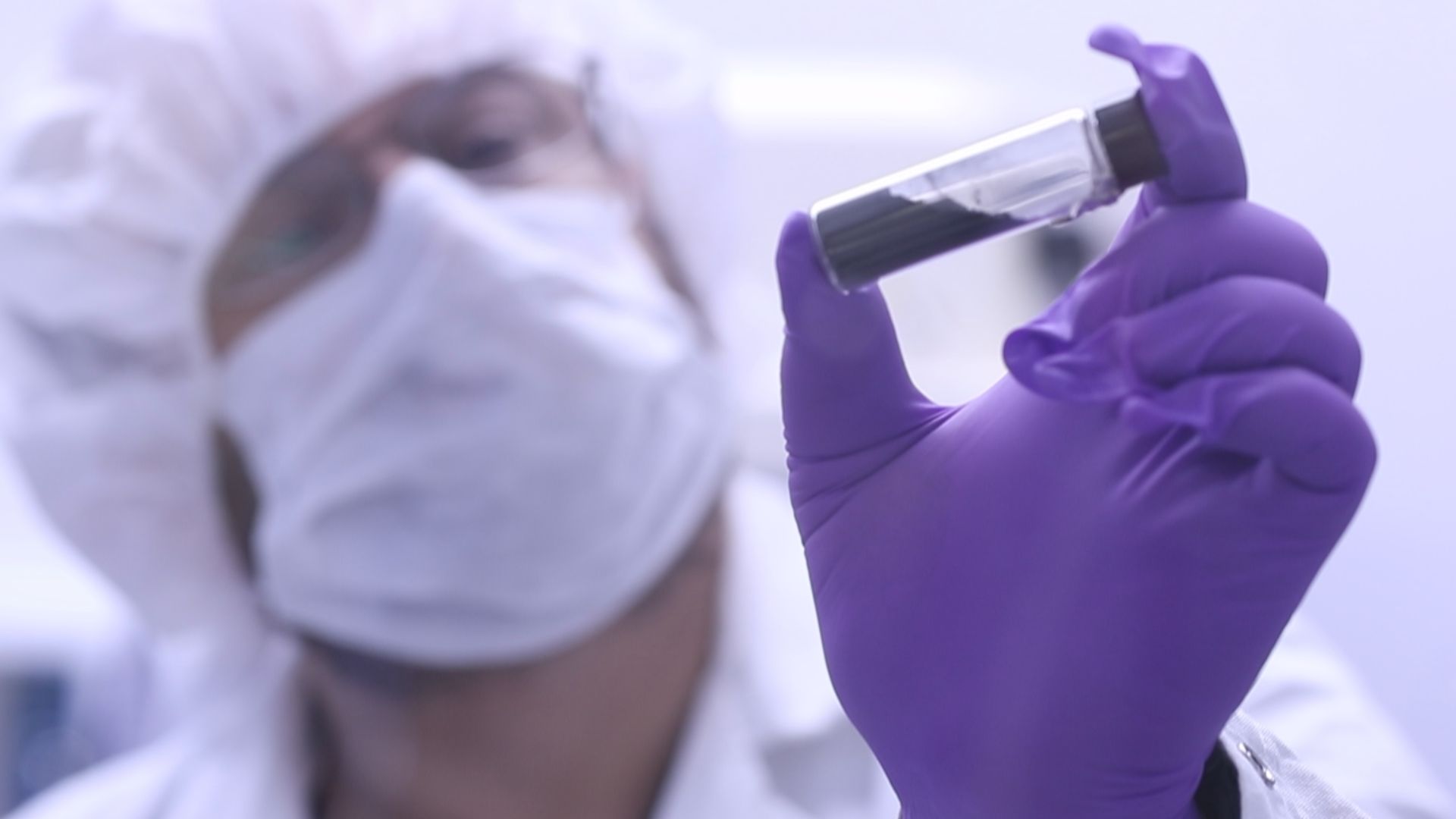 In this video frame, Jason Dworkin holds up a vial that contains part of the sample from asteroid Bennu delivered to Earth by NASA's OSIRIS-REx (Origins, Spectral Interpretation, Resource Identification, and Security – Regolith Explorer) mission in 2023. 