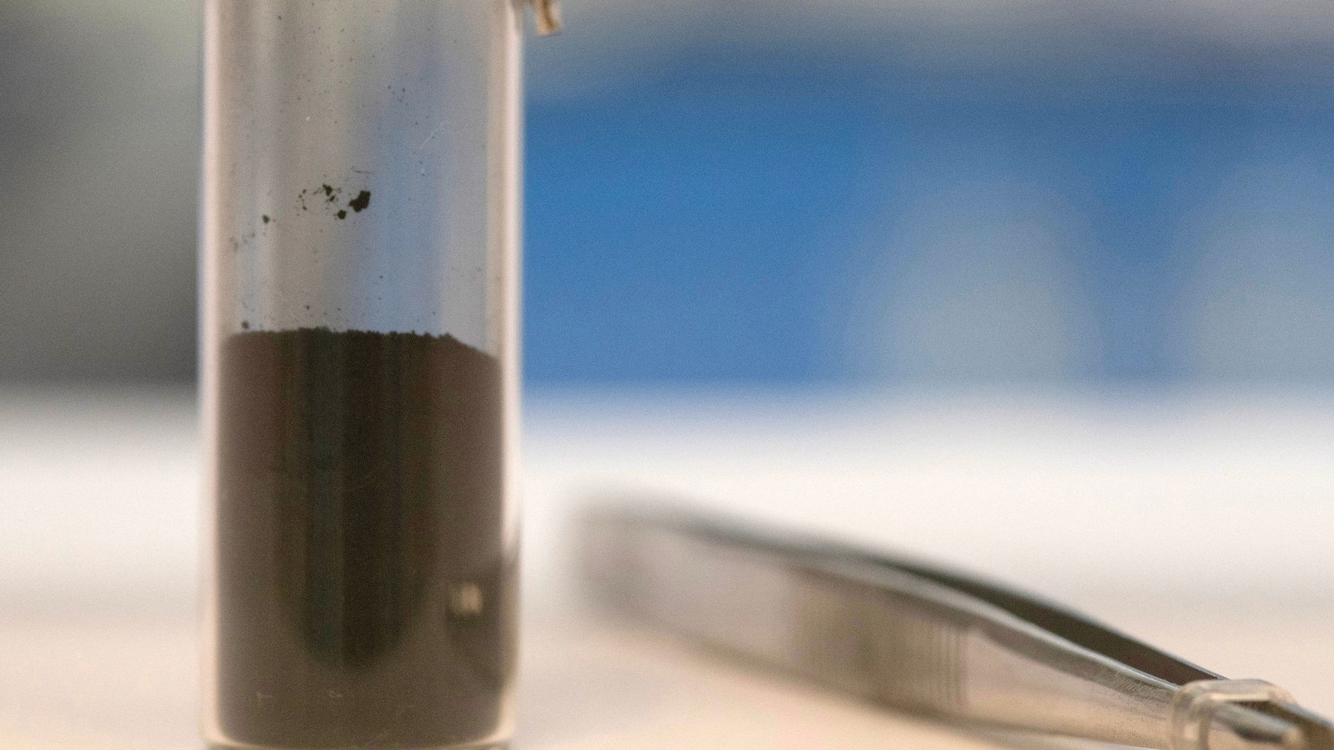 Photographed inside a laboratory at NASA's Goddard Space Flight Center in Greenbetl, Maryland, this vial contains a portion of the asteroid Bennu sample delivered to Earth by the agency's OSIRIS-REx (Origins, Spectral Interpretation, Resource Identificati