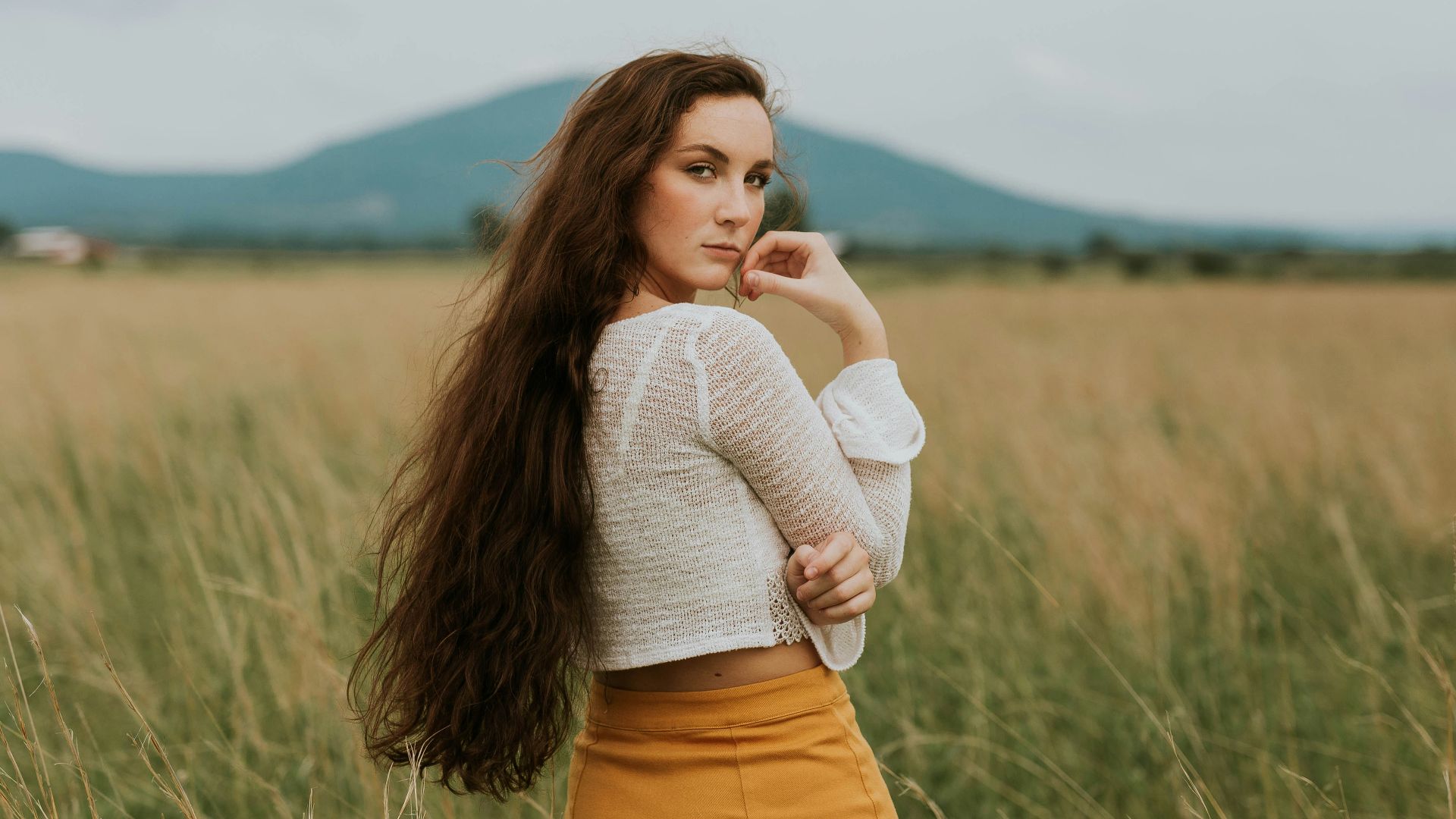woman standing on grass field