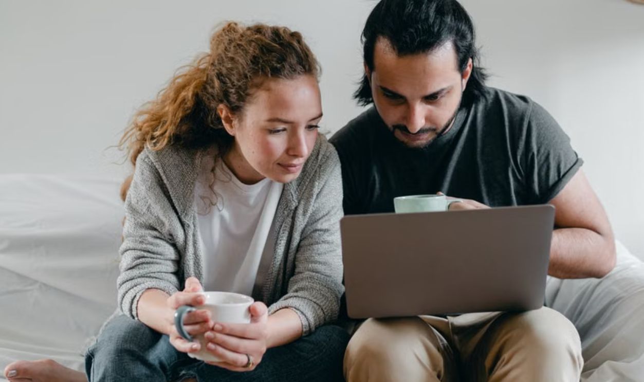 couple checking weather news
