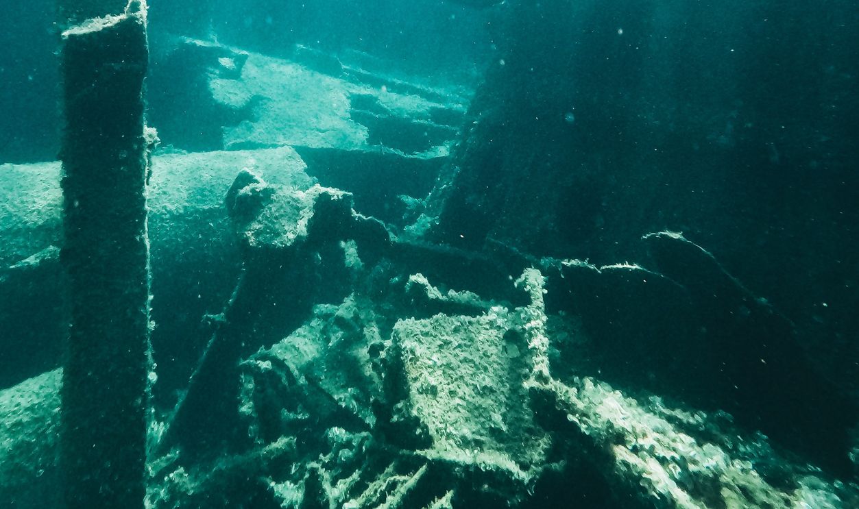 Explore the mystery of an underwater shipwreck in the ocean's depths