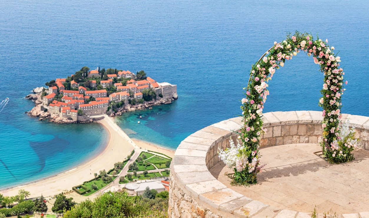 Montenegro's Sveti Stefan as a picturesque wedding destination, combining historic architecture with breathtaking coastal views.