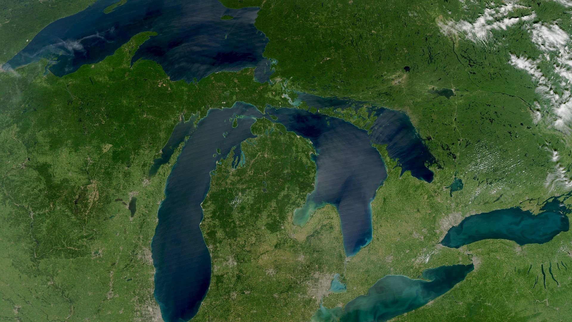In Late August 2010 the Moderate Resolution Imaging Spectroradiometer aboard NASA's Aqua satellite provided a rare satellite view of a cloudless summer day over the entire Great Lakes region. North Americans trying to sneak in a Labor Day weekend getaway