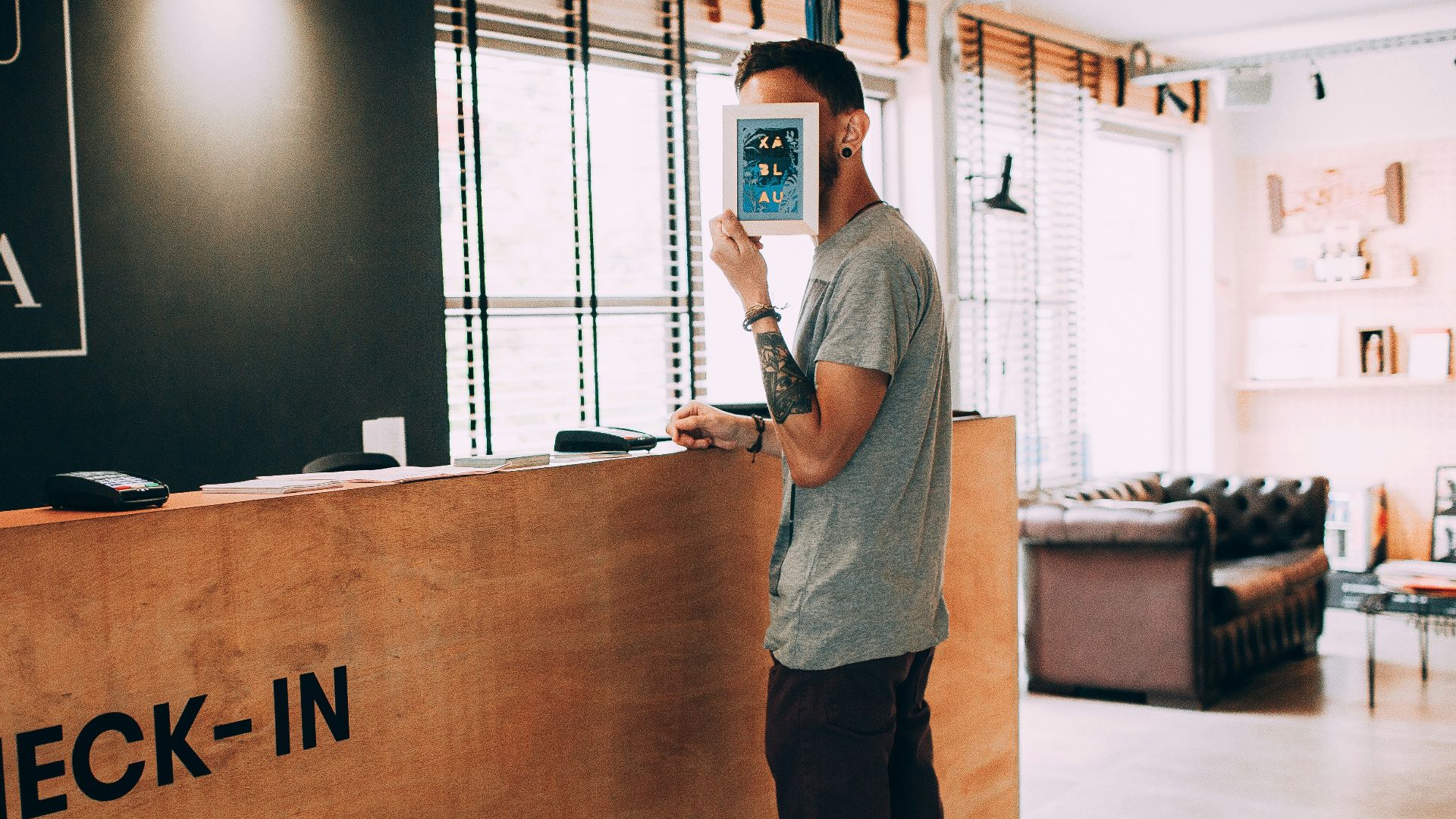 man standing beside counter