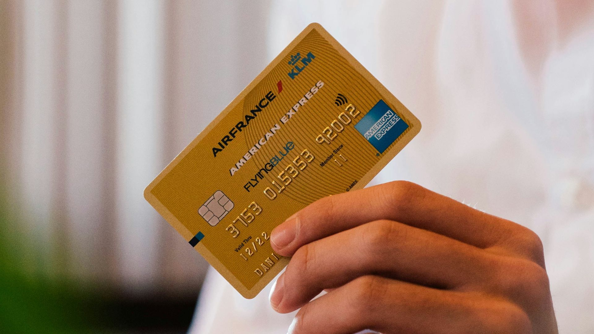 person holding credit card