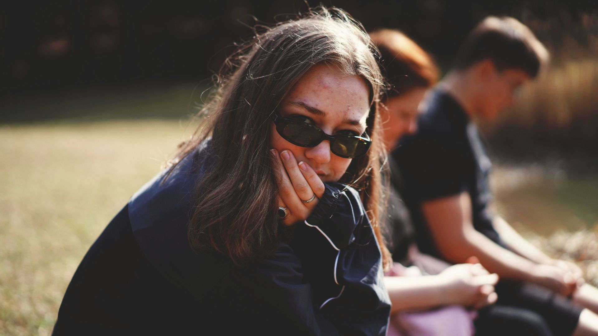 woman in black and white shirt wearing black sunglasses