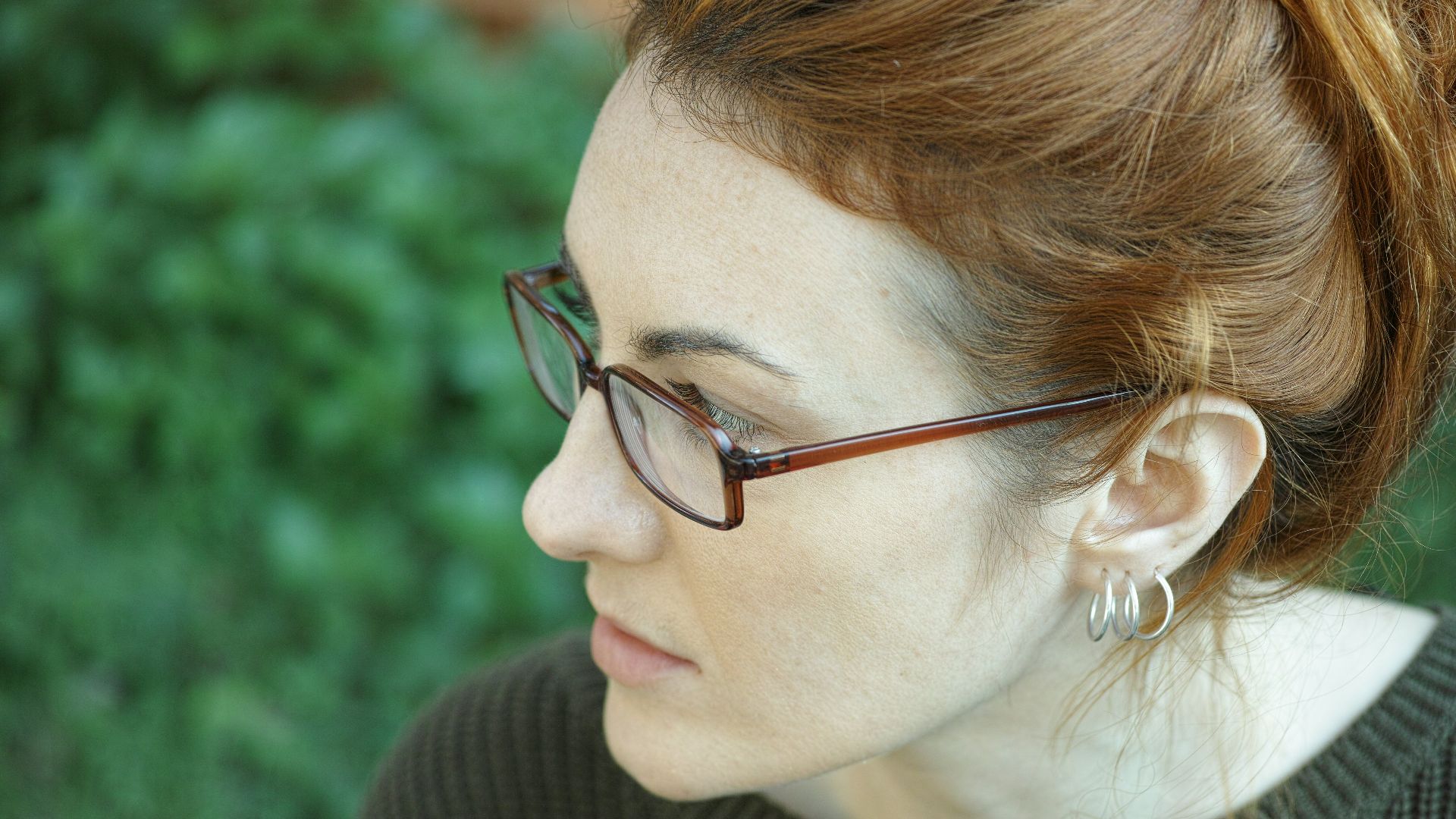 woman in black turtleneck shirt wearing eyeglasses