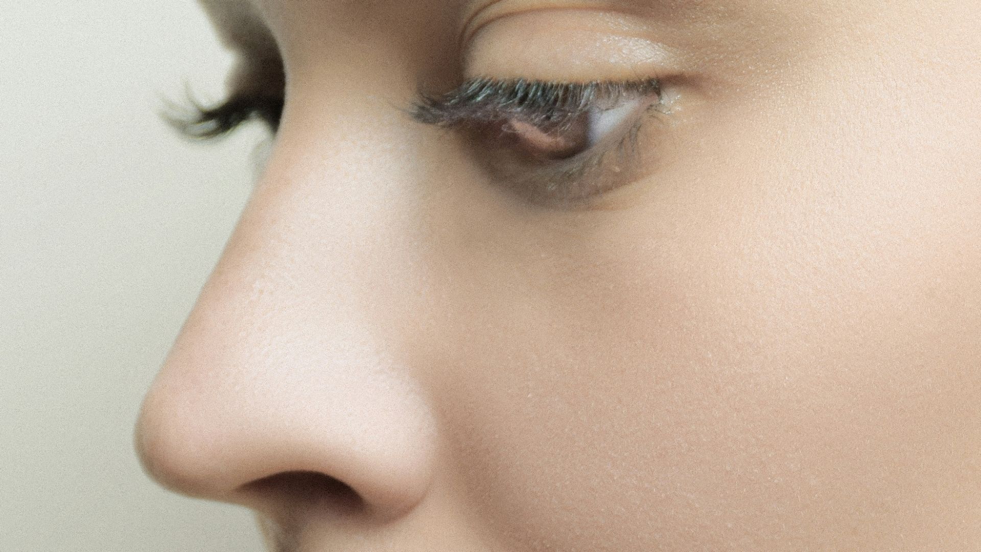 a close up of a woman's face with her eyes closed