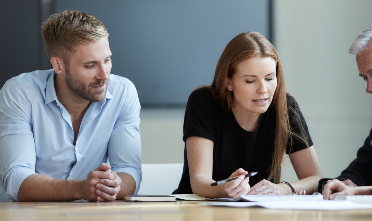 Business people reviewing paperwork in meeting