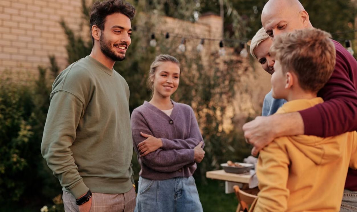 Happy, multiethnic group enjoying outdoor leisure time in summer, bonding and having fun together