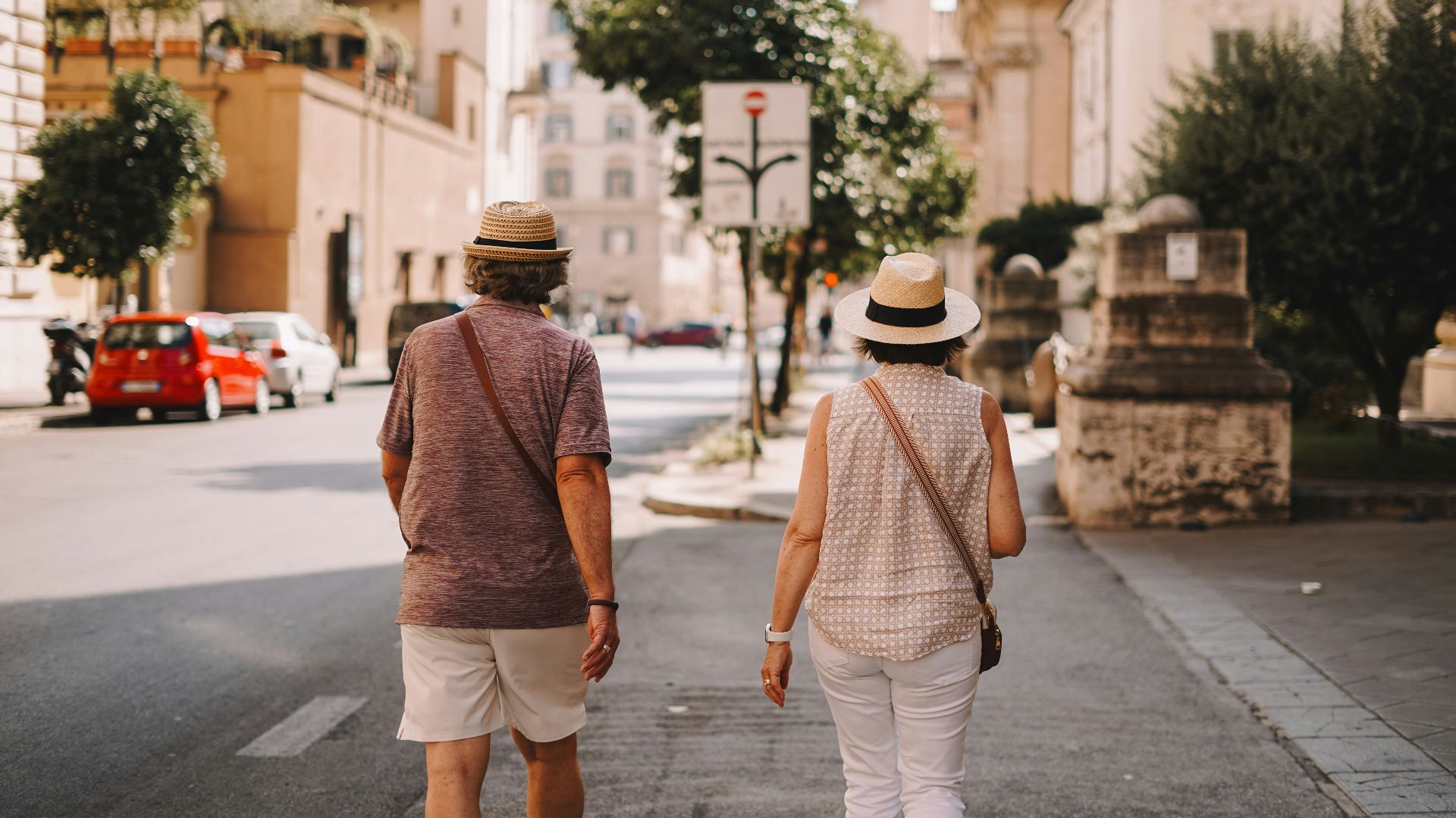 A man and a woman walking down a street