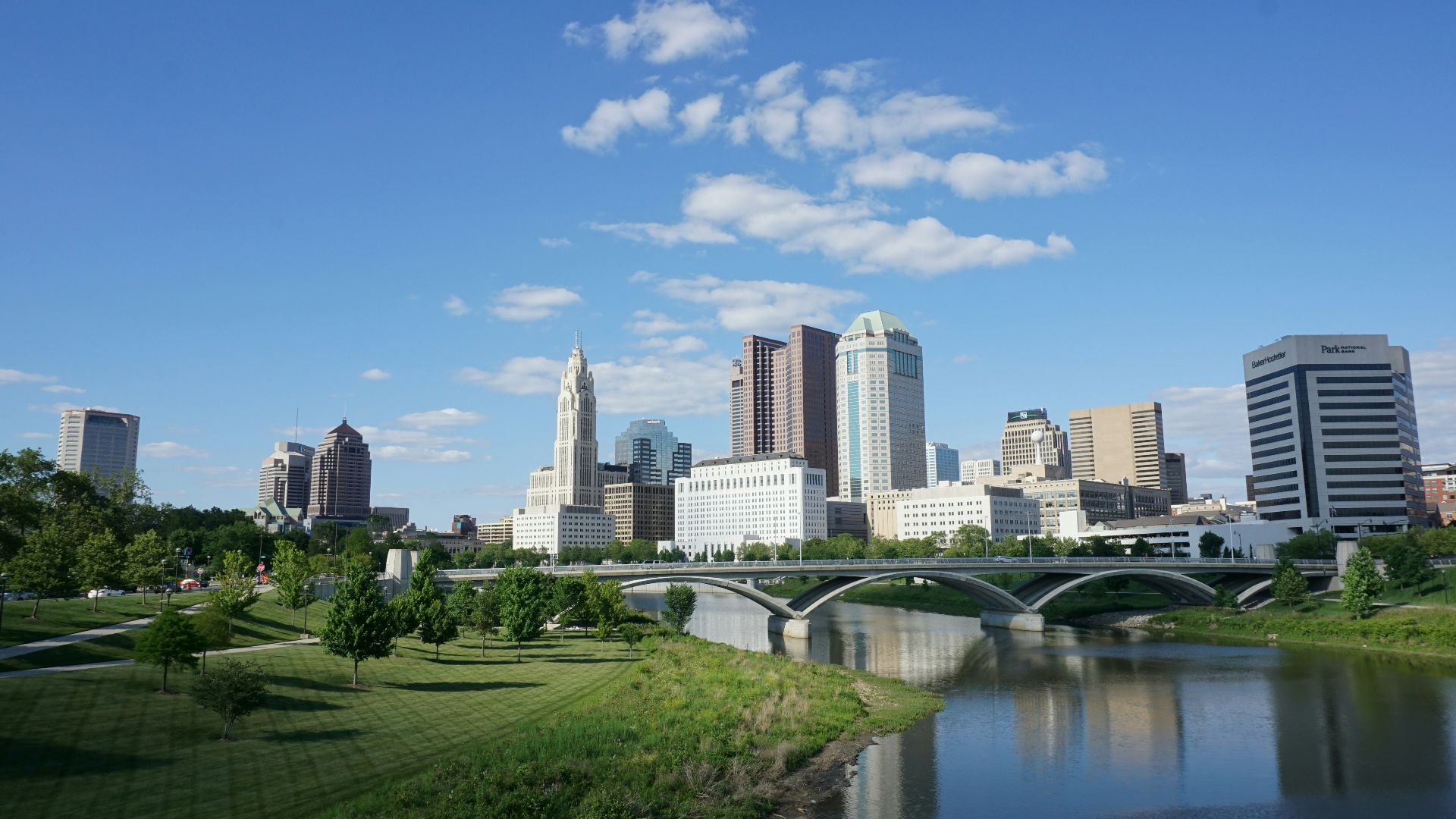 a view of a city with a bridge over a river