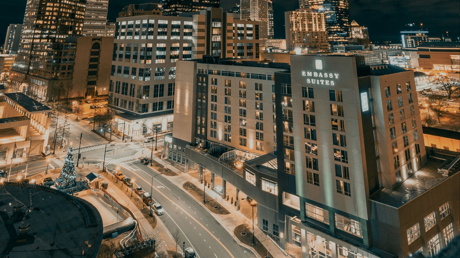 city buildings under dark clouds during night time