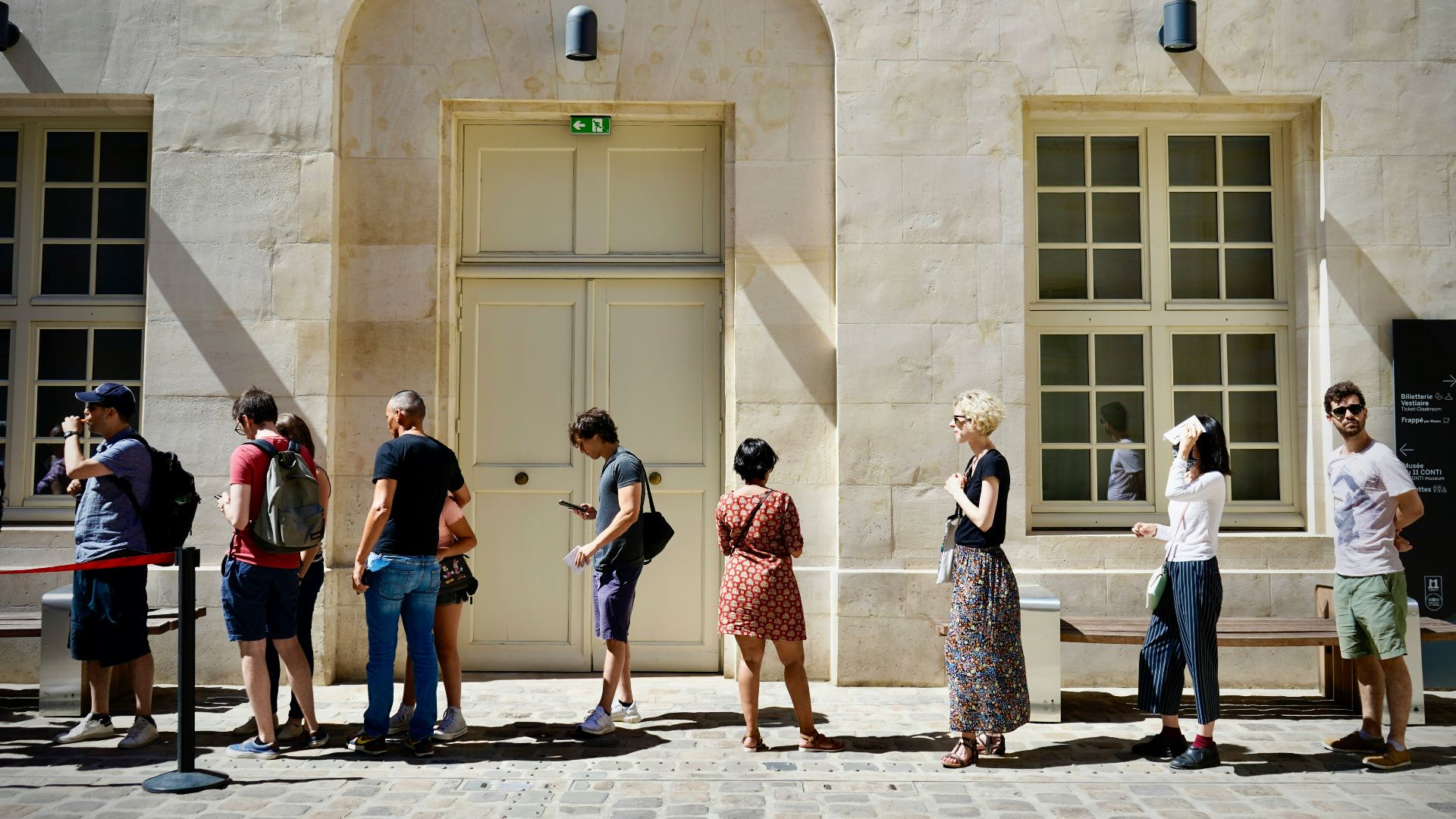 a group of people standing outside a building