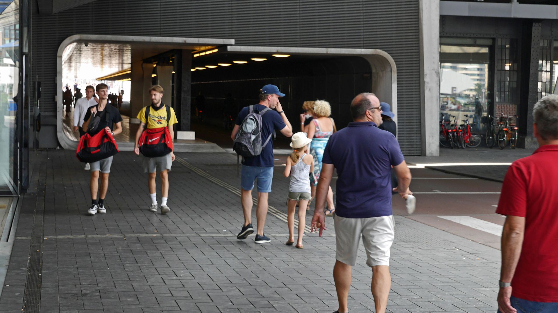 people walking on sidewalk during daytime