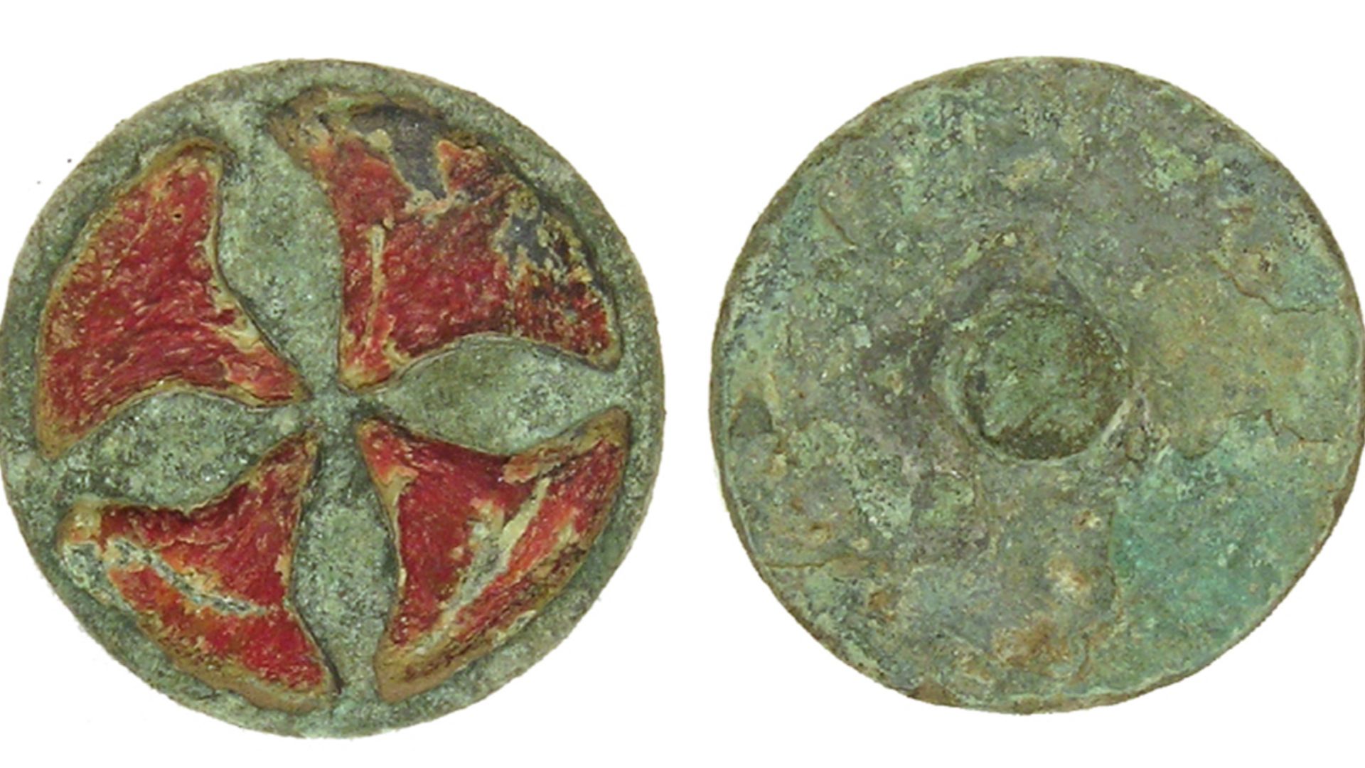 Possibly a small enamelled cast copper-alloy mount/decorative fitting (possibly a button or pin head?) dating from either the Late Iron Age/Roman period, i.e. c. 300BC-AD410, or the medieval period, i.e. c. AD1200-1500. The artefact is circular with a mou