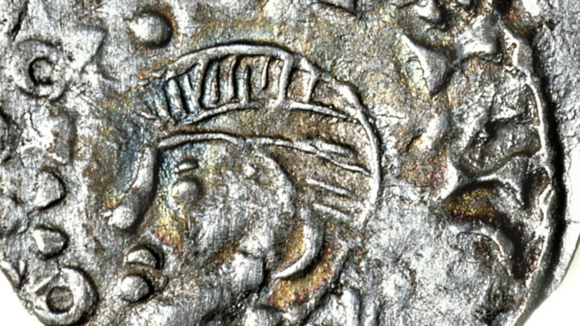 Norwegian silver penning minted during reign of Magnus Barefoot; circa 1093-1103 AD. Obverse features bust facing left surrounded by an unreadable inscription, reverse shows double cross in the center with a small circle in the middle in a solid ring. Unr