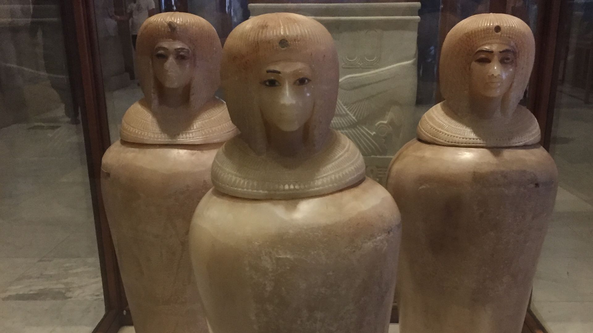 Three of the four canopic jars from KV55 displayed in the Egyptian Museum, Cairo. The fourth jar is in the Metropolitan Museum of Art. They probably bear the likeness of Kiya, wife of Akhenaten