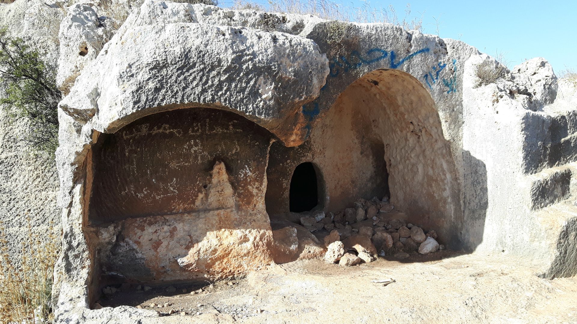 The ruins of the elaborated tomb show an ancient arch damaged by grave robbers