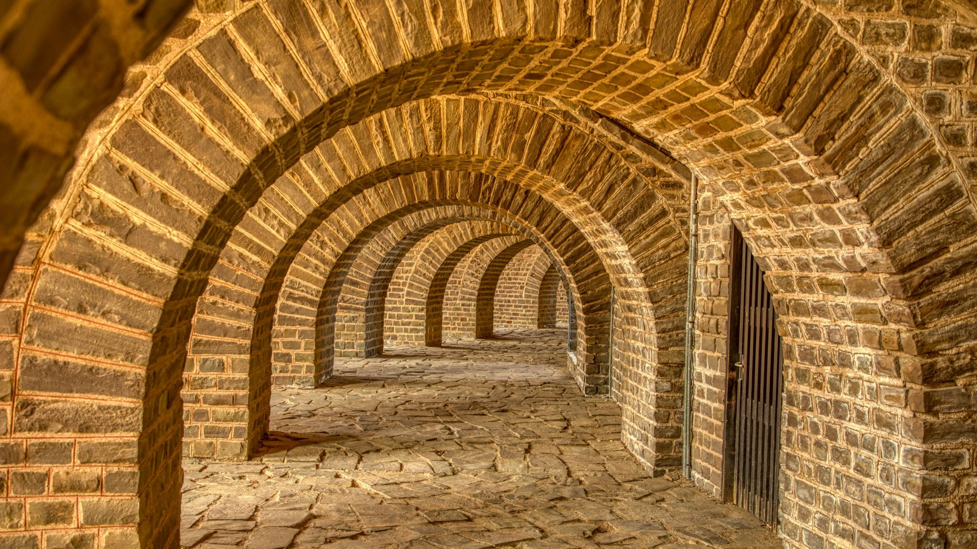 brown and beige concrete tunnel