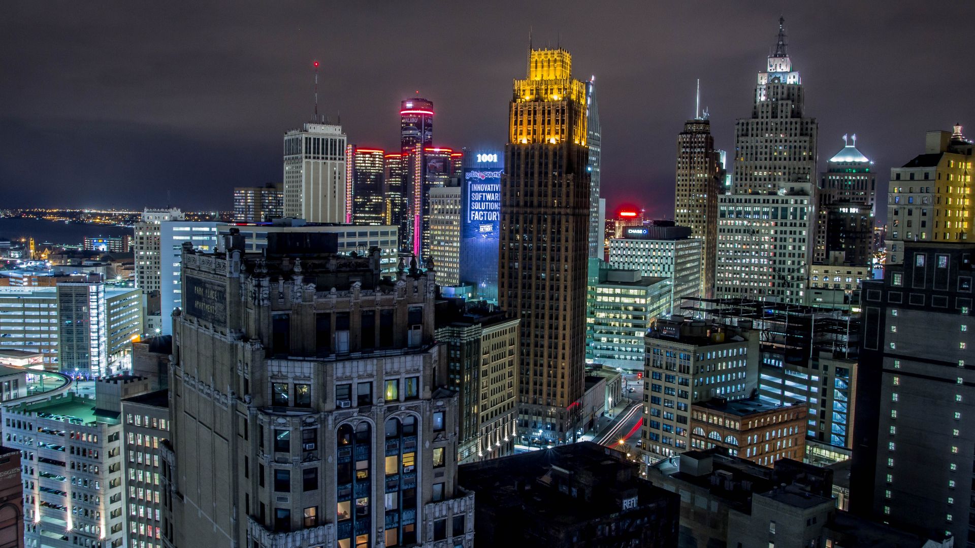 Night-time skyline shot of glowing city that is Detroit.