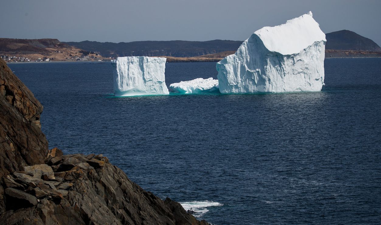 An iceberg floats in the Atlantic Ocean, April 26, 2017 off the coast of Port Kirwan, Newfoundland, Canada. Icebergs break off from Baffin Island and Greenland every spring and drift down the stretch of water along the coast of Newfoundland and Labrador known as Iceberg Alley. According to media reports, the higher number of icebergs this season can be attributed to uncommonly strong counter-clockwise winds that draw the icebergs south and possibly global warming, which could be making Greenland's ice sheet melt faster.