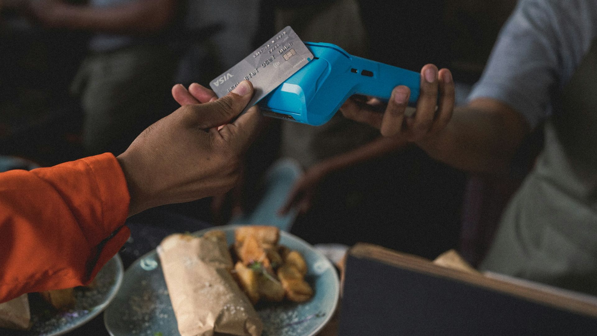 a person holding a blue object in their hand