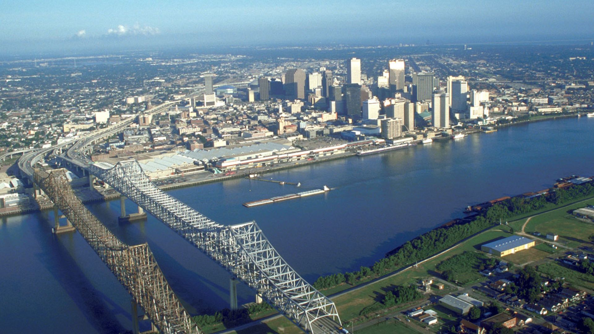 Skyline of New Orleans, Louisiana, USA. The twin spans of the Crescent City Connection bridges are in the foreground.
