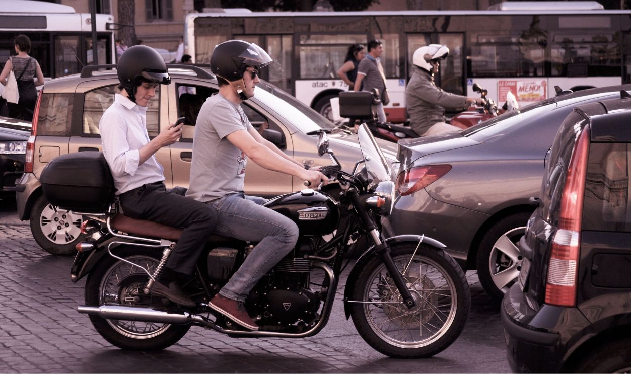 Motorcyclists using smartphones 