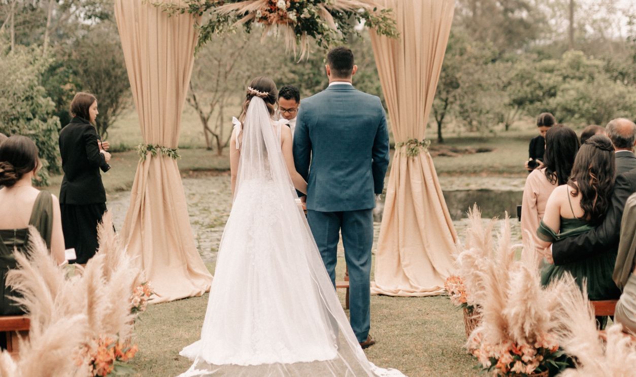 Elegant outdoor wedding ceremony with the bride and groom at the altar