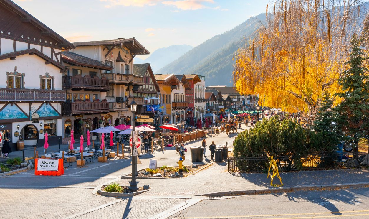 Leavenworth, Washington, USA - December 1 2021: Autumn afternoon at the Bavarian themed village of Leavenworth, Washington, with themed sidewalk cafes and shops on the pedestrian main street.