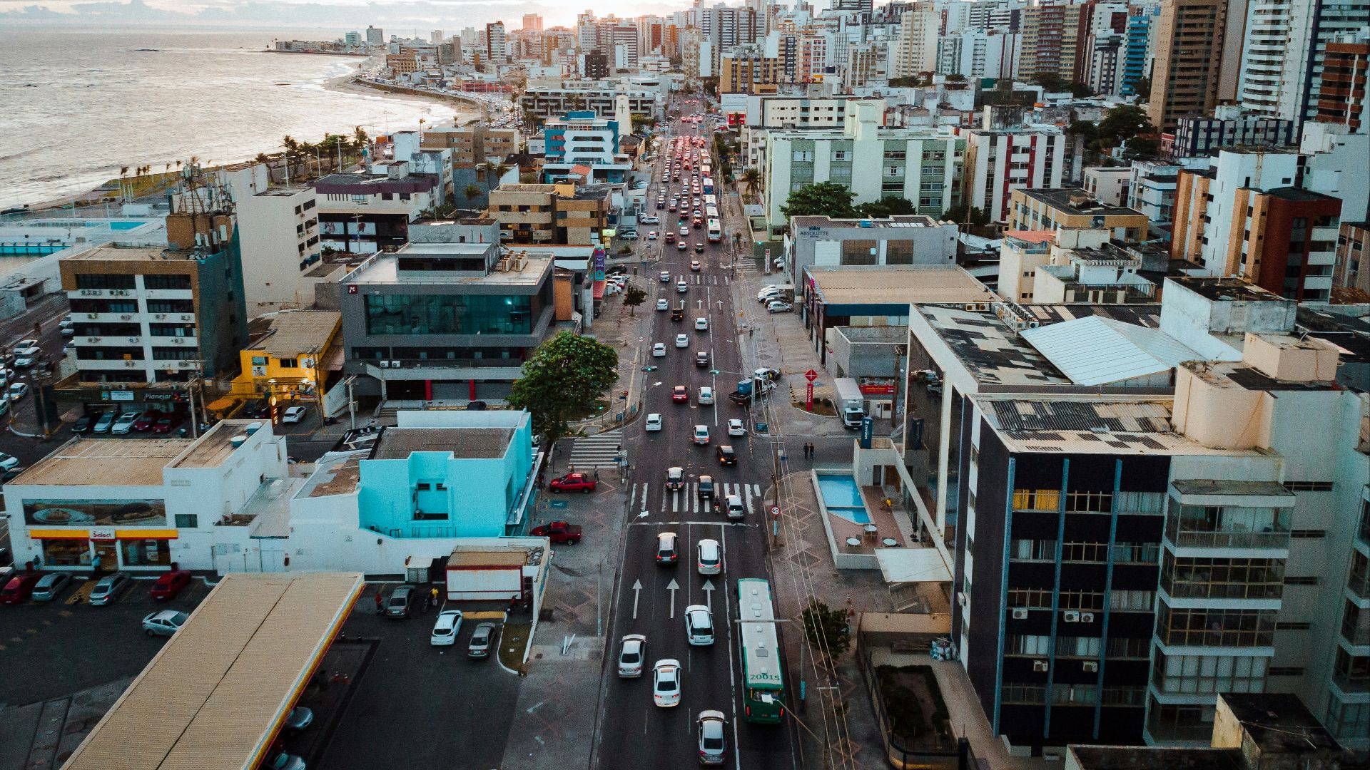 aerial photography of vehicles on road near buildings during daytime