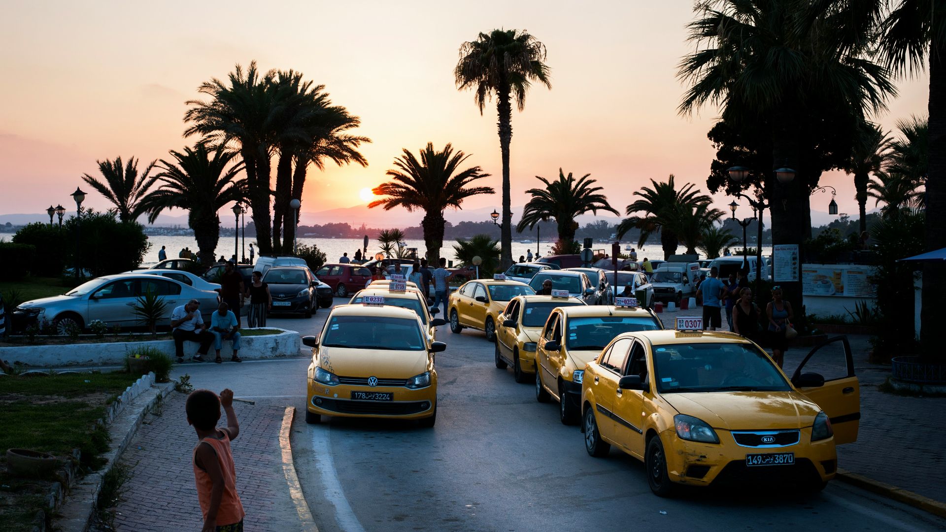 yellow taxis parked in line