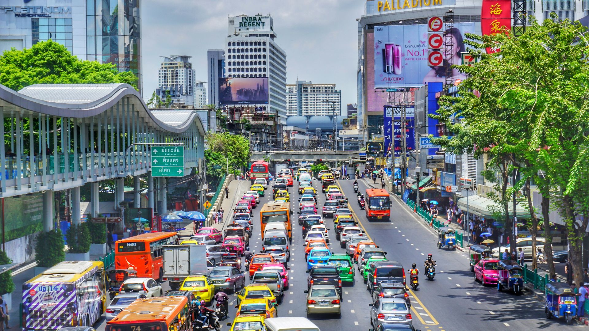 cars on road near buildings during daytime